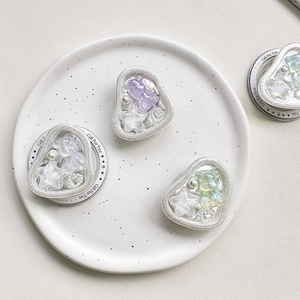 Cute bear and star magnetic phone socket set in a decorative white ceramic dish