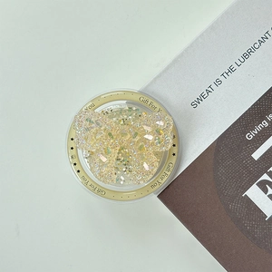 Detail of glitter crystal bear phone grip with Gift For You engraving and gold ring