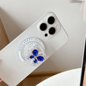 Support de téléphone papillon luxueux en strass avec gemmes bleues sur un smartphone