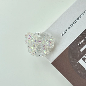 Macro detail of iridescent glitter butterfly phone socket with sparkling sequins