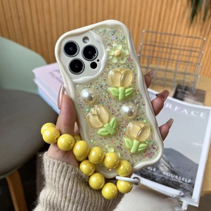 Detail of iPhone case with cream wavy edges, 3D tulips, pearls and a beaded lanyard