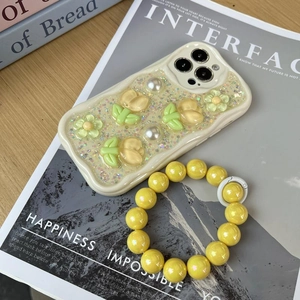 Creamy wavy iPhone case with yellow tulip pearls and matching beaded wrist strap