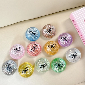 Sparkly sequin round phone socket grip set with black bow pattern in multiple colors