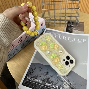 Detail of tulip and pearl 3D relief phone case with matching yellow bead wrist strap