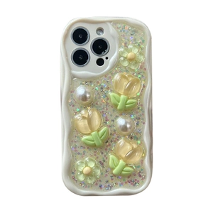 Glitter iPhone case with wavy cream edges featuring 3D tulip and pearl floral decorations