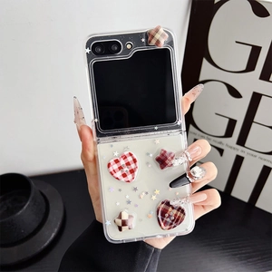 Detailed view of Z Flip case featuring vintage red grid hearts and 3D star button charms