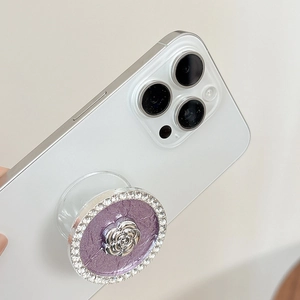 Macro detail of luxury crystal phone socket with silver camellia and purple texture