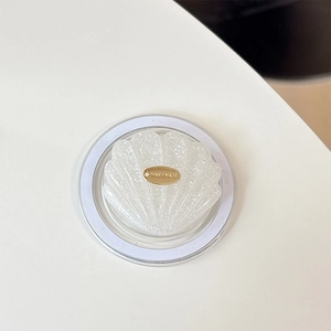Detail of seashell glitter phone socket with a gold HAND MADE metal tag for MagSafe
