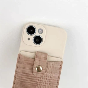 Detail view of iPhone leather wallet case featuring brown houndstooth pattern and card slot