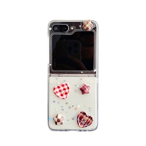 Clear Samsung Galaxy Z Flip protective case with 3D red plaid heart and star charms