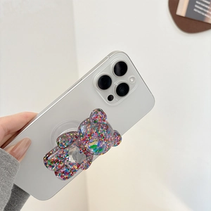 Cute bear phone socket stand with colorful glitter held on white smartphone