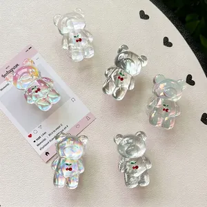 Laser holographic bear phone grip with cherry pattern on white leather background