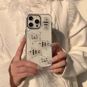 Detail of transparent iPhone case featuring 3D embossed cartoon cat and glitter stars