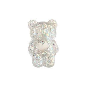 Sparkling bear phone grip with glitter and heart motif on a clean white background