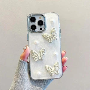Detail of 3D butterflies and pearls on the pearlescent iPhone case surface