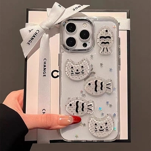 Detail of transparent iPhone case featuring 3D cartoon cat, fish and silver star sequins