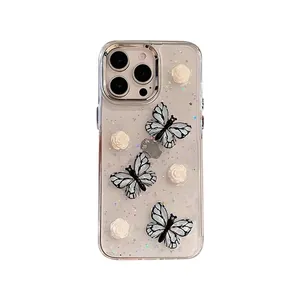 IPhone case with 3D blue butterflies, white roses, and sparkling silver glitter decoration