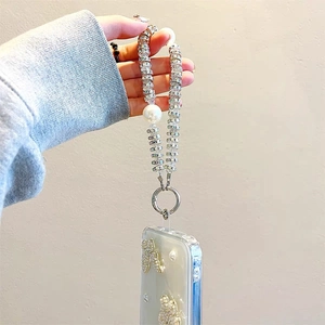 Luxury iPhone case with 3D pearl butterfly design and matching beaded wrist strap