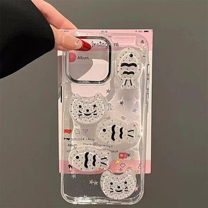 Detail of transparent iPhone case with 3D cat and fish charms and pink social media card