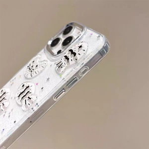 Detail of glitter iPhone case featuring 3D spotted cat and silver star decorations
