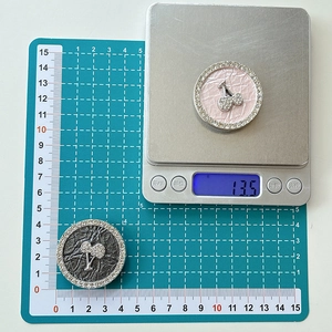 Macro shot of sparkling rhinestone cherry phone socket showing 4cm diameter and 13.5g weight