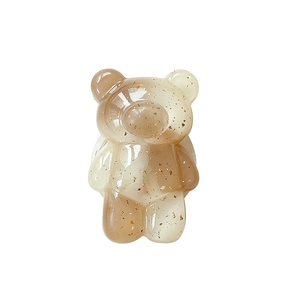 Transparent bear phone stand with gold foil insert, foldable expanding grip on white background