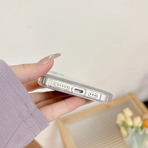 Detail of transparent soft case for iPhone 16 with precise cutouts and side model marking