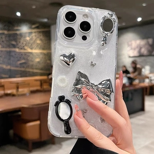 Mirror bow heart phone case for iPhone 16 Pro Max with silver glitter and 3D charms