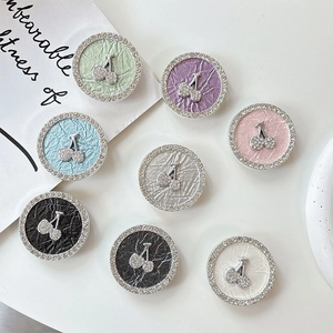 Sparkling rhinestone cherry phone socket grips in various colors with leather texture base