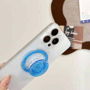 Blue glitter sequins MagSafe phone socket grip shown on the back of a smartphone