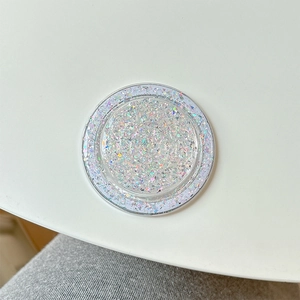 Detail shot of MagSafe phone grip with holographic glitter and sequins in clear resin