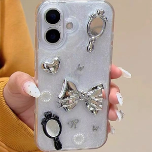 Close-up of glitter iPhone case with 3D silver bow, magic mirror, and heart charms