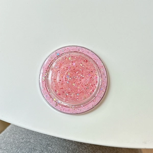 Pink glitter resin MagSafe phone socket with holographic sequins on white background