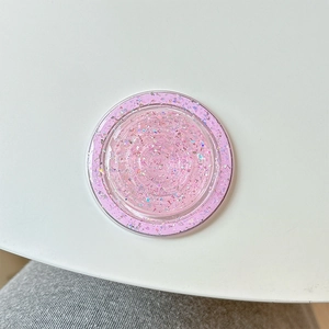 Detailed top view of pink glitter and sequin circular MagSafe phone grip