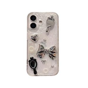 Sparkly glitter iPhone case with mirror bow and heart charms in Y2K aesthetic style