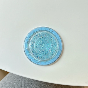 Detail of sky blue MagSafe phone grip with sparkling glitter and blue sequins
