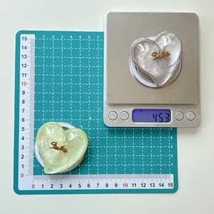 Macro detail of heart-shaped glitter Magsafe phone stand showing 5.5cm size and 45.3g weight