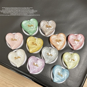 Glittering MagSafe heart phone grips with pearlescent finish and Smile text