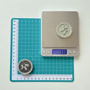 Detailed view of rhinestone balloon dog phone grip measuring 13.8g on a digital scale
