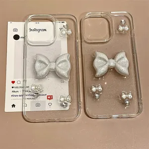 Close-up of glitter iPhone case with 3D ribbon bow and heart charms decoration