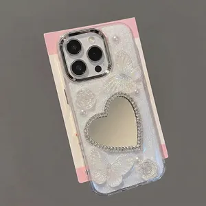 Custodia per iPhone glitterata con farfalla e rosa, dotata di specchio a cuore con strass