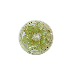 Light green flower phone grip with gold edges and crystal center on gift display card