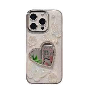 Custodia iPhone rosa glitterata con farfalle 3D, perle e uno specchio a cuore con strass