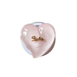 Pink glitter heart MagSafe phone grip with gold Smile lettering on white background