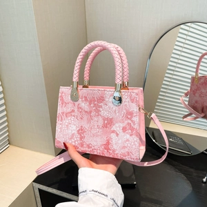 Pink woven jacquard small square handbag with braided handle and gold metal hardware