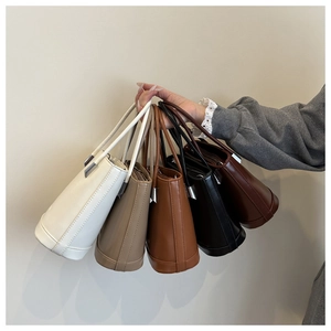 Detailed collection of minimalist bucket bags in five colors with silver hardware