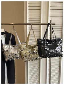 Close-up of three sequin tote bags in silver, gold and black with Creative Cat label