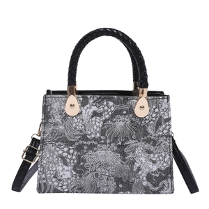 Retro black and white floral jacquard handbag with woven handles and gold hardware