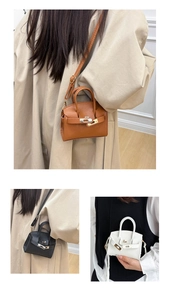 Mini Kelly-style crossbody bag detail showing leather texture and belt lock in three colors