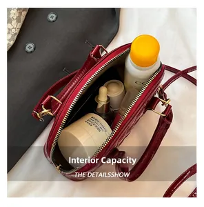 Macro view showing internal capacity of the wine red crocodile pattern shell bag